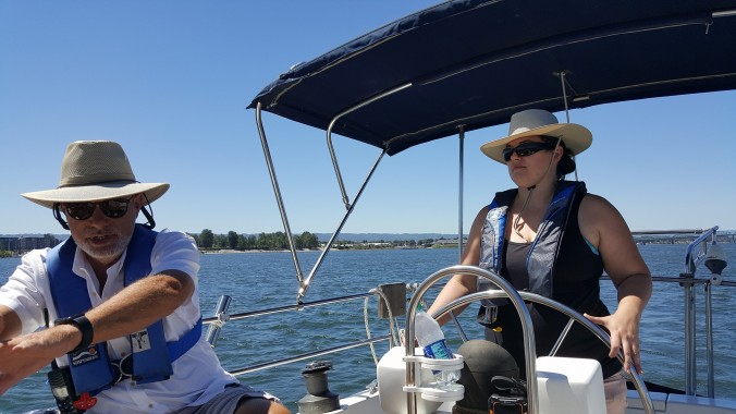 Captain Stephen coaching with Rachel at the helm last summer aboard the sailboat Mosaic