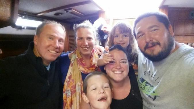Adventure Adrift crew and Mosaic Voyage family pose for selfie aboard the sailboat SV Mosaic in Portland OR.