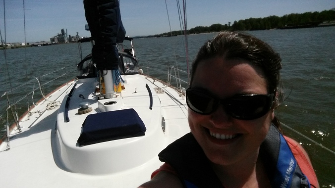 Selfie on the bow of the sailboat as we head downriver