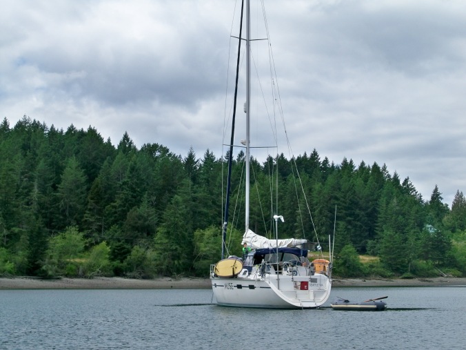 SV Muse sitting at anchor in Oro Bay on Anderson Island